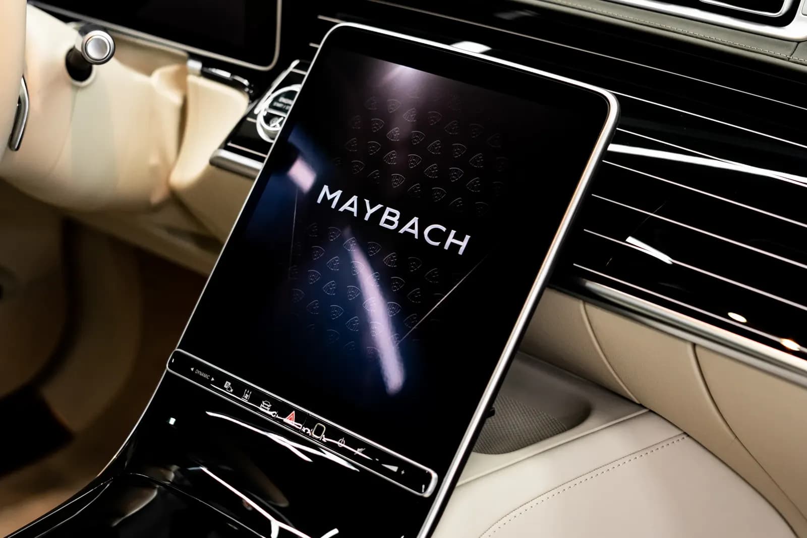 Close-up of the centre display showing the Maybach logo inside a luxury car.