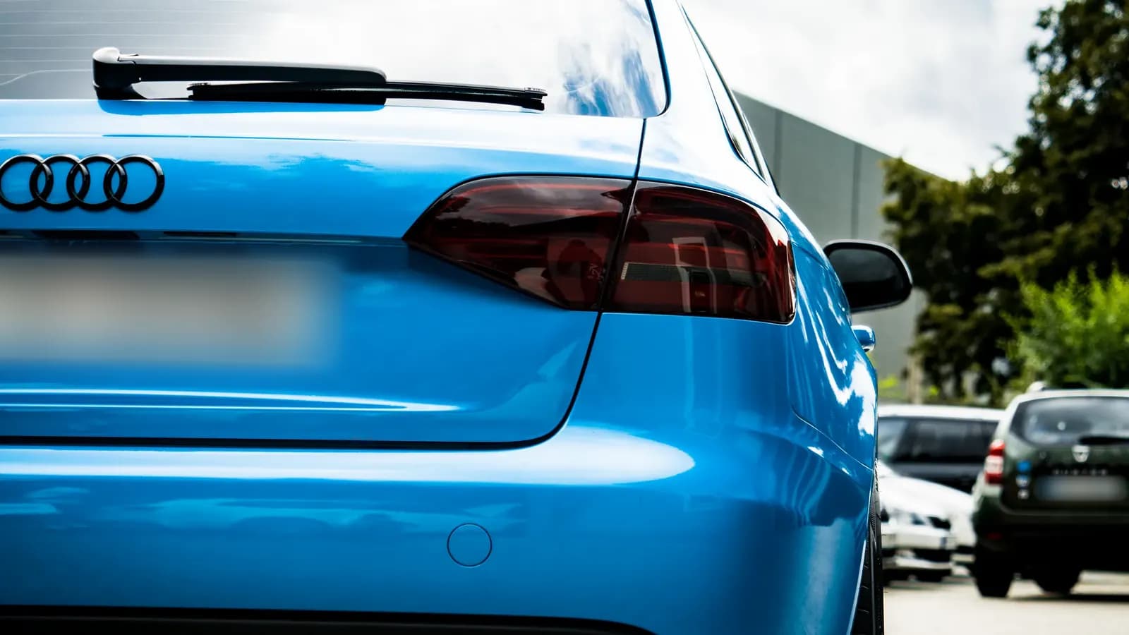 Close-up of the rear light and tailgate of a blue Audi.