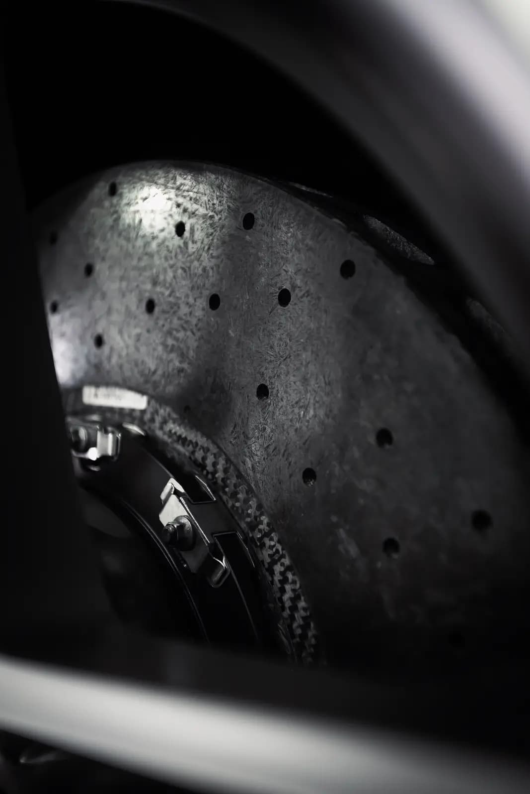 Macro of a drilled carbon-ceramic brake disc.